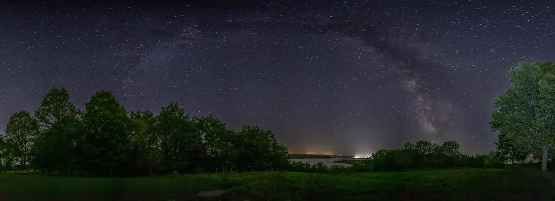 The Milky Way spanning the night sky over the Mississippi River, Minnesota, USA
